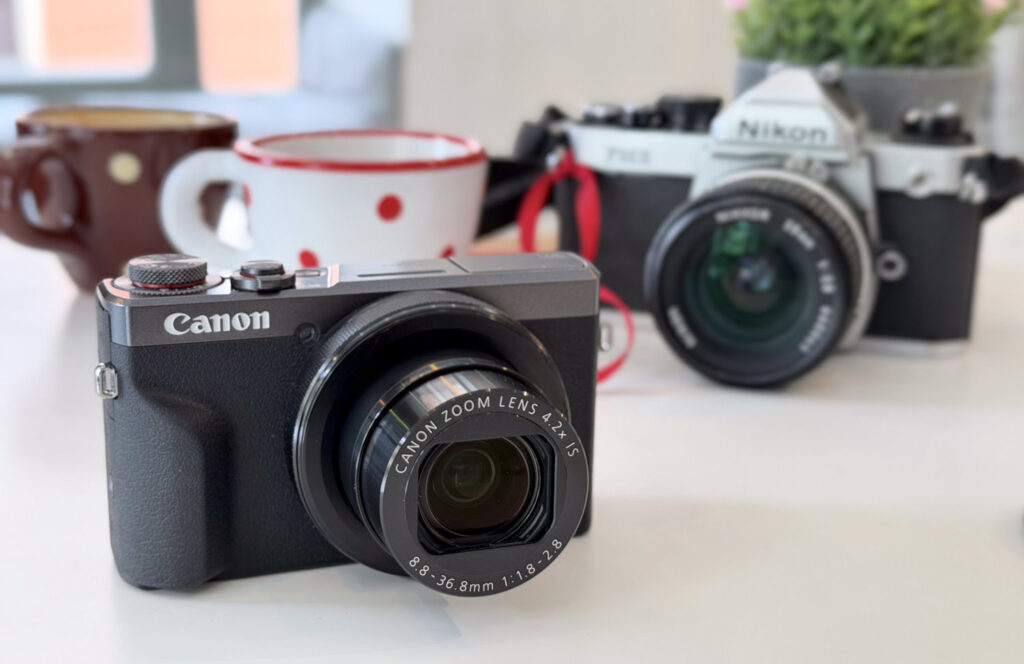 Canon PowerShot G7 X Mark III - cameras on a table